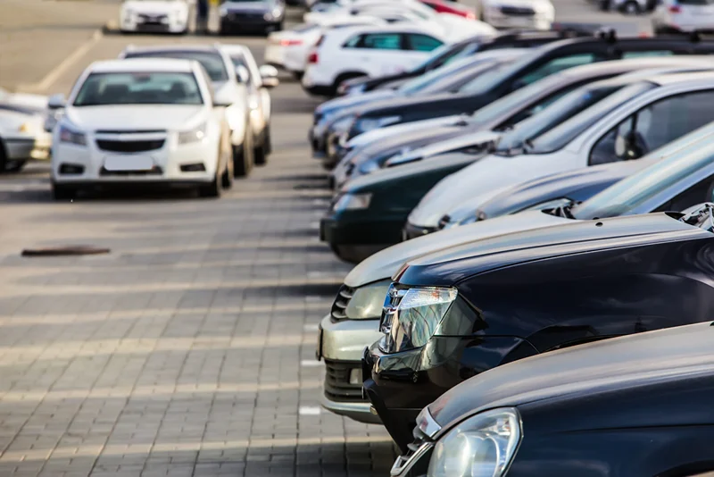 Parking lot full of vehicles, we remove junk cars from lots and driveways in Milton